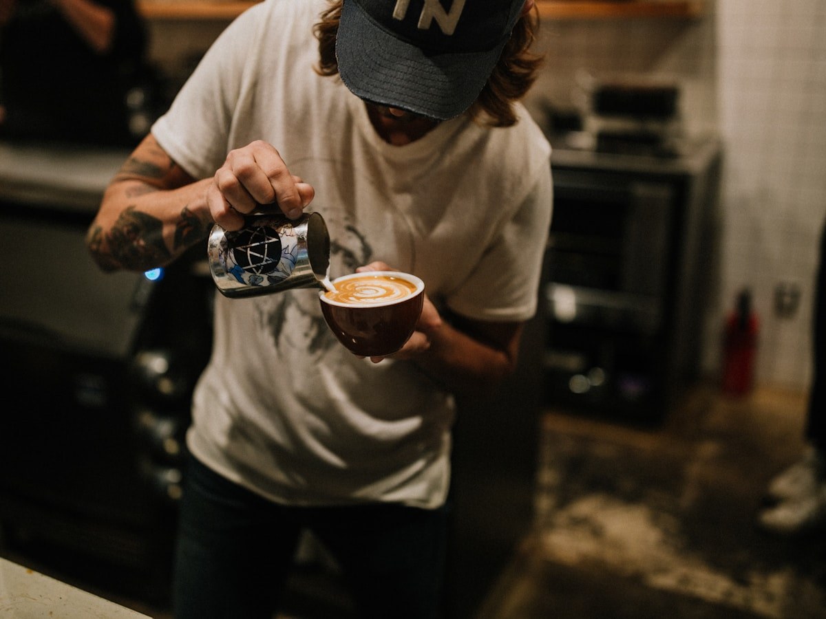 Barista pouring latte art